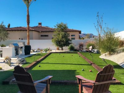 Artificial turf bocce court with outdoor seating and landscaped surroundings in Austin, Texas
